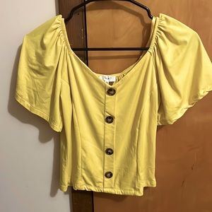 Bright yellow top with buttons, flowy sleeves